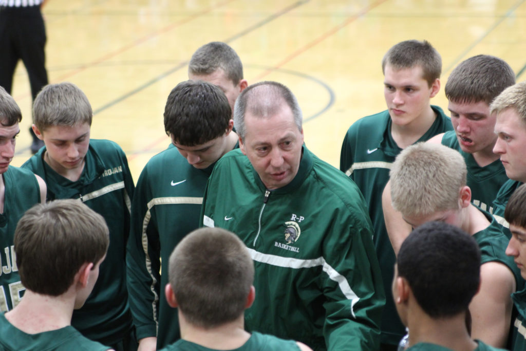 Rushford-Peterson coach Tom Vix directs his team