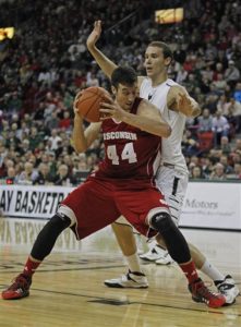 Wisconsin's Frank Kaminsky posts up against Winona, Minn., native Alec Brown of UW-Green Bay on Nov. 16, 2013, in Green Bay, Wis. Wisconsin won 69-66. (AP Photo/Matt Ludtke)