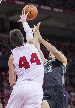 Badgers center Frank Kaminsky gets one of his seven blocks. - AP Photo by Andy Manis