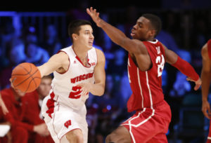 Wisconsin guard Bronson Koenig (24) dishes against Oklahoma. PHOTO: Kevin Jairaj, USA TODAY