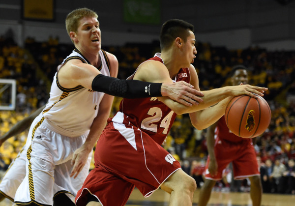 Wisconsin guard Bronson Koenig (24) drives past UW-Milwaukee guard Cody Wichmann (5). PHOTO: Benny Sieu, USA TODAY