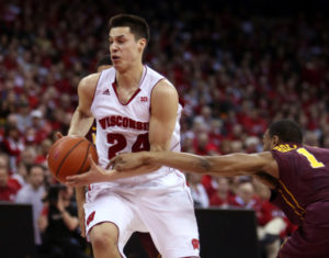 Wisconsin guard Bronson Koenig (24) drives past Minnesota guard Andre Hollins (1) at the Kohl Center. PHOTO: Mary Langenfeld, USA TODAY