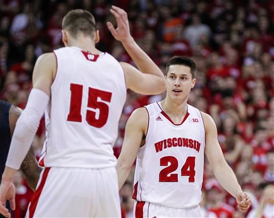 Wisconsin's Bronson Koenig (24) high-fives Sam Dekker after hitting a 3-pointer during against Illinois. | Andy Manis, AP