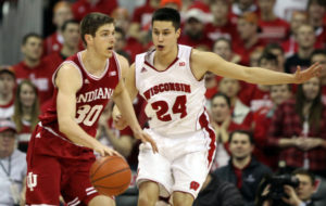 Indiana forward Collin Hartman (30) runs offense with Wisconsin's Bronson Koenig (24) defending, at the Kohl Center. PHOTO: Mary Langenfeld (USA TODAY)