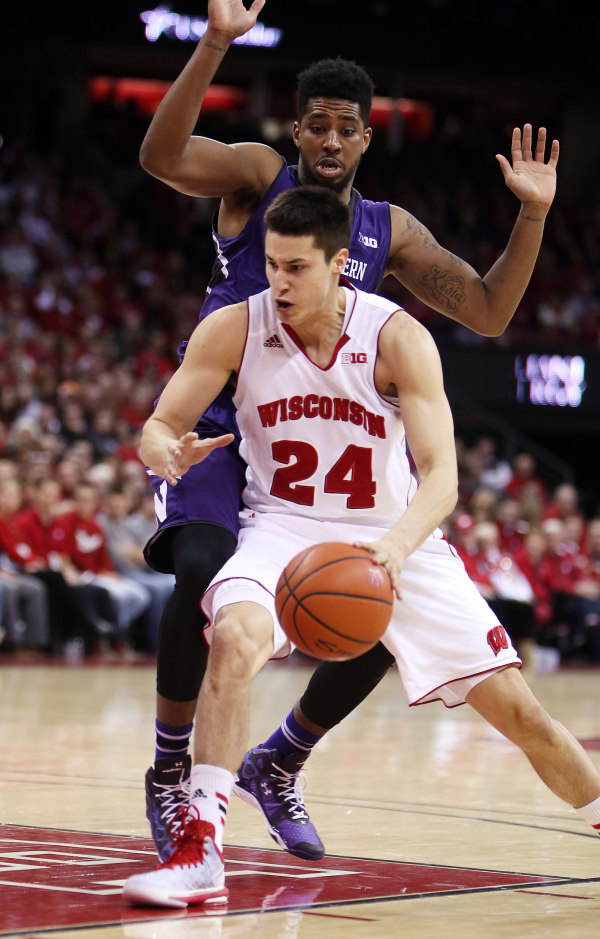 Wisconsin guard Bronson Koenig (24) spins on Northwestern guard JerShon Cobb at the Kohl Center. PHOTO: Mary Langenfeld (USA TODAY)